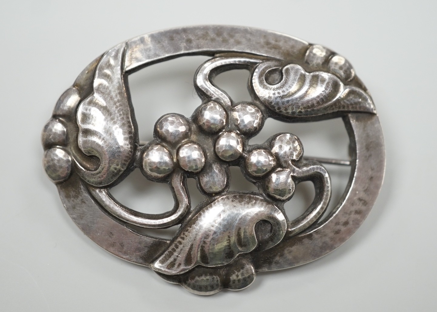 A Georg Jensen modern sterling silver oval leaf and berry brooch, design no. 101, 48mm, with Jensen box.